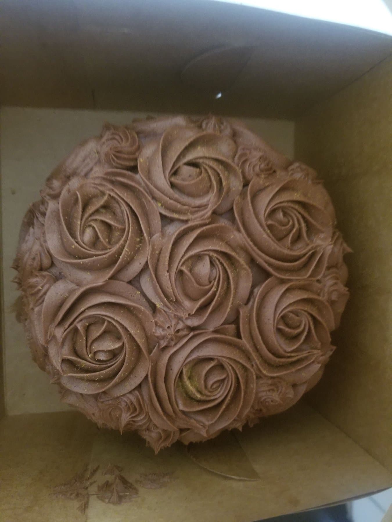 Chocolate rosette cake with full buttercream swirl coverage by Jamie Cakes.