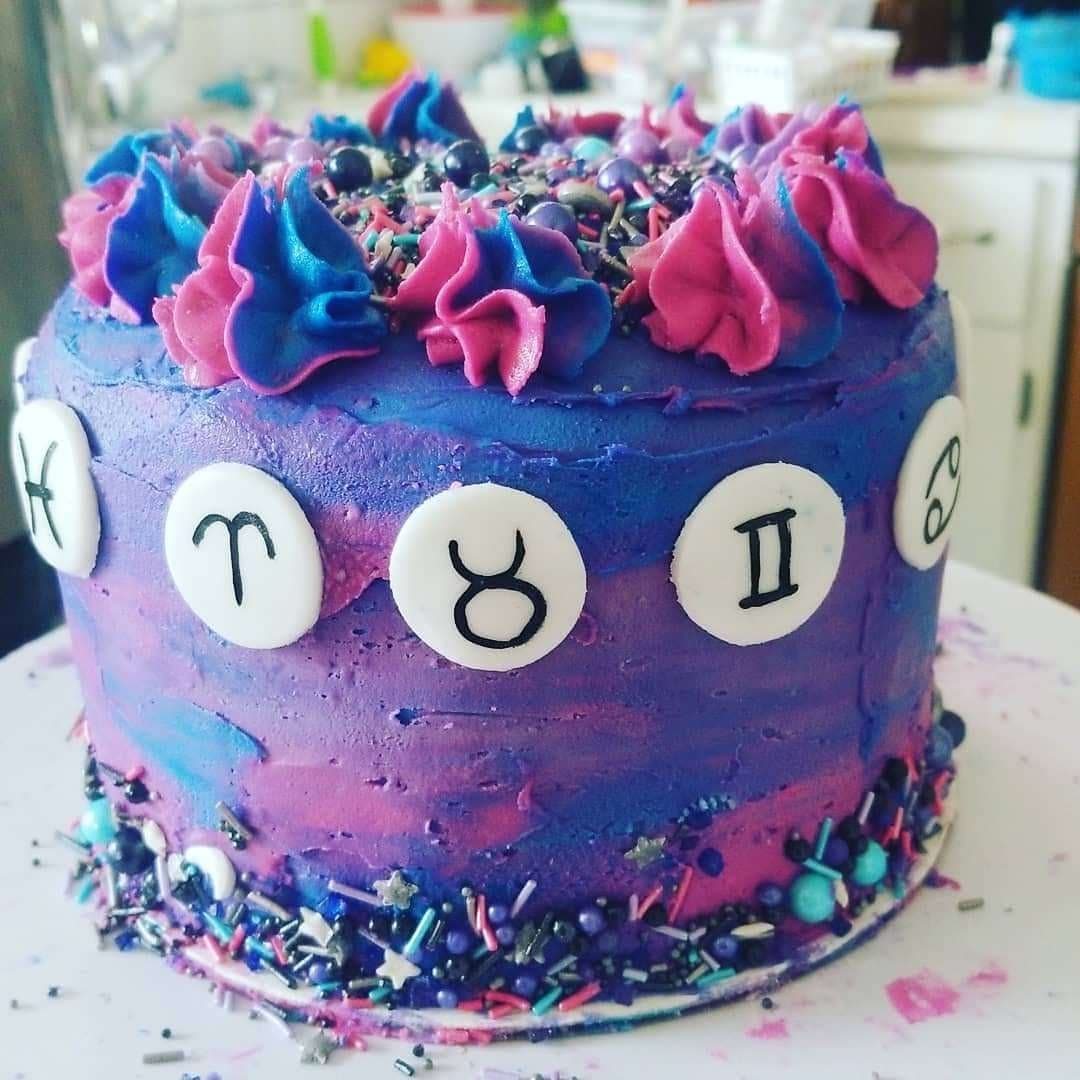 Galaxy zodiac birthday cake with bold purple and pink frosting by Jamie Cakes.